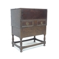 An 18th century and later oak converted bible box, on later stand, lift lid and single drawer, turne... 