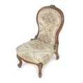 A Victorian walnut nursing chair, moulded frame, tapestry upholstered, cabriole front legs with smal... 