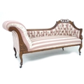 A late Victorian mahogany framed chaise longue, with carved and moulded frame, upholstered with butt... 