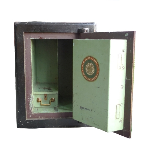 306 - A Victorian cast iron safe, by J. E. Bates & Sons, painted green with brass handle, fitted internall... 