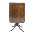 A Regency mahogany and crossbanded tea table, the rectangular tilt top surface with rounded corners ... 
