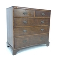A 19th century oak chest of two over three drawers, raised upon bracket feet, brass oval handles, 10... 