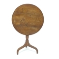 A 19th century oak tilt top table, with turned column and tripod base, 68 by 73cm high.