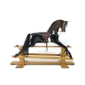 A Haddon Rockers rocking horse, circa 1980s, fibreglass body painted black with brown seat, on a pin... 