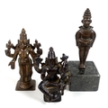 Three bronzed cast metal statues of Hindu deities, a 19th century bronzed metal figural group of Shi... 
