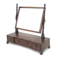 A Victorian mahogany toilet mirror, rectangular plate in a cushion moulded frame, turned supports, b... 