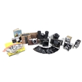A collection of vintage cameras and lenses, including a Praktica FX with Tessar 2.8/50 Carl Zeiss Je... 