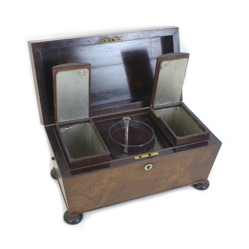 111 - A Regency rosewood tea caddy, of sarcophagus form, the lift lid opening to reveal two lift out domed... 