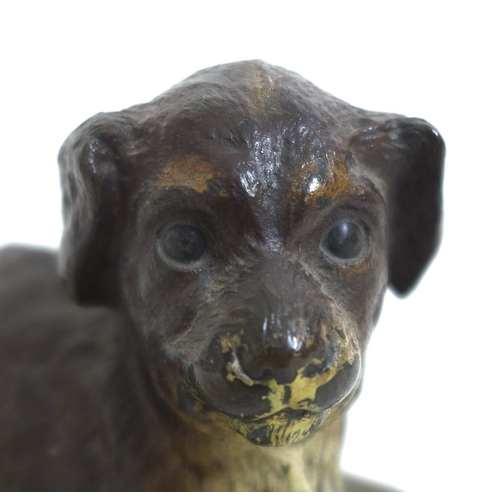 128 - A 19th century cold-painted bronze sculpture, modelled as a recumbent dog, cast stamp 'Déposé' to ba... 