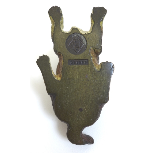 128 - A 19th century cold-painted bronze sculpture, modelled as a recumbent dog, cast stamp 'Déposé' to ba... 