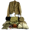 A Royal Artillery uniform circa 1950, including jacket, webbing, trousers, cap, beret, cap badges an... 