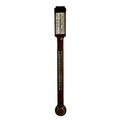 An early 19th century stick barometer, by Thomas Rubergall, the mahogany case with thermometer, cadd... 