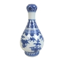 A Chinese porcelain Ming style garlic mouth vase, decorated in heaped and piled style underglaze blu... 
