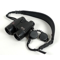 A late 20th century pair of Leica 8x42 BA binoculars, with rubberised casing and padded strap, 14.5c... 