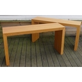 A pair of late 20th century Heals of London, oak console tables with solid slab sides, both with Hea... 