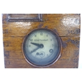 An Alfred Plasschaert Ghent pigeon racing timing clock, numbered '8152', in a dove tailed oak case, ... 