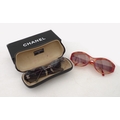 A pair of Chanel and Christian D'Or sunglasses, the Chanel sunglasses with case and box, the Christi... 