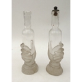 Two late 19th century barber bottles with hand shaped bases, one with stopper labelled 'I. C. Boldoo... 