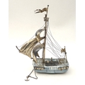 An early 20th century silver and delft ware sailing ship, with silver sails and mast, stamped 5905 t... 