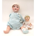 An Armand Marseilles bisque headed doll stamped '995' with sleepy eyes and open mouth 50cm tall A/F,... 