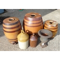 Three 19th century stoneware barrels, plus two jugs and one metal garden urn. (6)