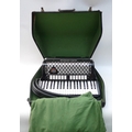 A 1990s Melodia piano accordion, with associated hard case.