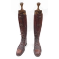 A pair of vintage tan leather riding boots with Alkit boot trees. (2)