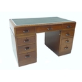 A 1930s mahogany pedestal desk with green inlaid top, two banks of three drawers, and chrome handles... 