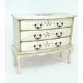 A highly decorative small hand painted shabby chic chest of drawers.