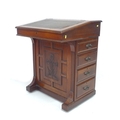 A late Victorian mahogany Davenport, with single bank of four drawers, in need of restoration.