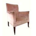 An Edwardian armchair, upholstered in pink velvet, raised on mahogany square section tapering legs a... 