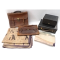 A group of vintage briefcases, a leather covered correspondence box, and two Egyptian souvenir texti... 