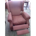 A Parker Knoll reclining armchair, burgundy diamond patterned fabric.
