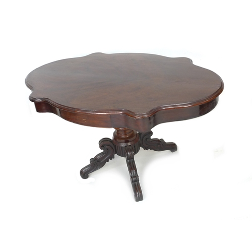 195 - A Victorian mahogany veneered centre table, the shaped surface with moulded edge, two frieze drawers... 