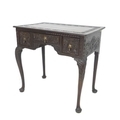 An early Georgian oak lowboy, with later carved all over decoration, single frieze drawer with brass... 