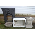 A reconstituted plinth, planter, cast iron fire surround and kitchen sink. (4)