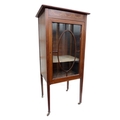 An Edwardian music cabinet with glazed door, and two bentwood cane seated chairs. (3)