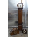 A group of three mid 20th century clocks, comprising an oak cased Grandmother clock of late Art Deco... 