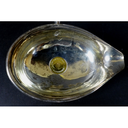 38 - A silver punch or toddy ladle inset with an 1800 George III coin, possibly a third Guinea, fitted to... 