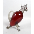 An Edwardian silver and white metal mounted, cranberry glass claret jug, in the style of Alexander C... 