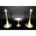 A pair of Elizabeth II silver candlesticks, each with  flared single knop tops and conical bases, Ba... 