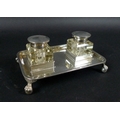 A late Victorian silver desk stand, with two cut glass silver lidded inkwells, John Grinsell & Sons,... 