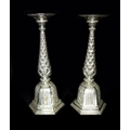 A pair of early 20th century Southern Indian silver candlesticks, the wide drip trays engraved with ... 