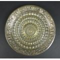A 19th century Southern Indian silver dish, of circular form, with profuse repousse decoration incor... 