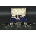 Two silver cruet sets, comprising a three piece George VI silver cruet set, with lidded mustard, 10 ... 
