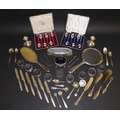 A group of Victorian and later silver wares, two cased sets of six teaspoons, including nine napkins... 
