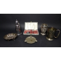 A group of silver and plated items comprising a Burmese silver beaker with chased and repousse panel... 