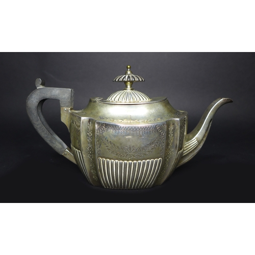 35 - A Victorian silver three piece tea set, with bright cut decoration and reeded bases, comprising teap... 