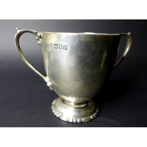 30 - A silver Christening set, Wakely & Wheeler London 1909-10 with twin handled cup, 11.8 wide (includin... 