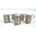 A set of five early 20th century silver mounted glass Turkish tea cups, the mounts with a pierced le... 